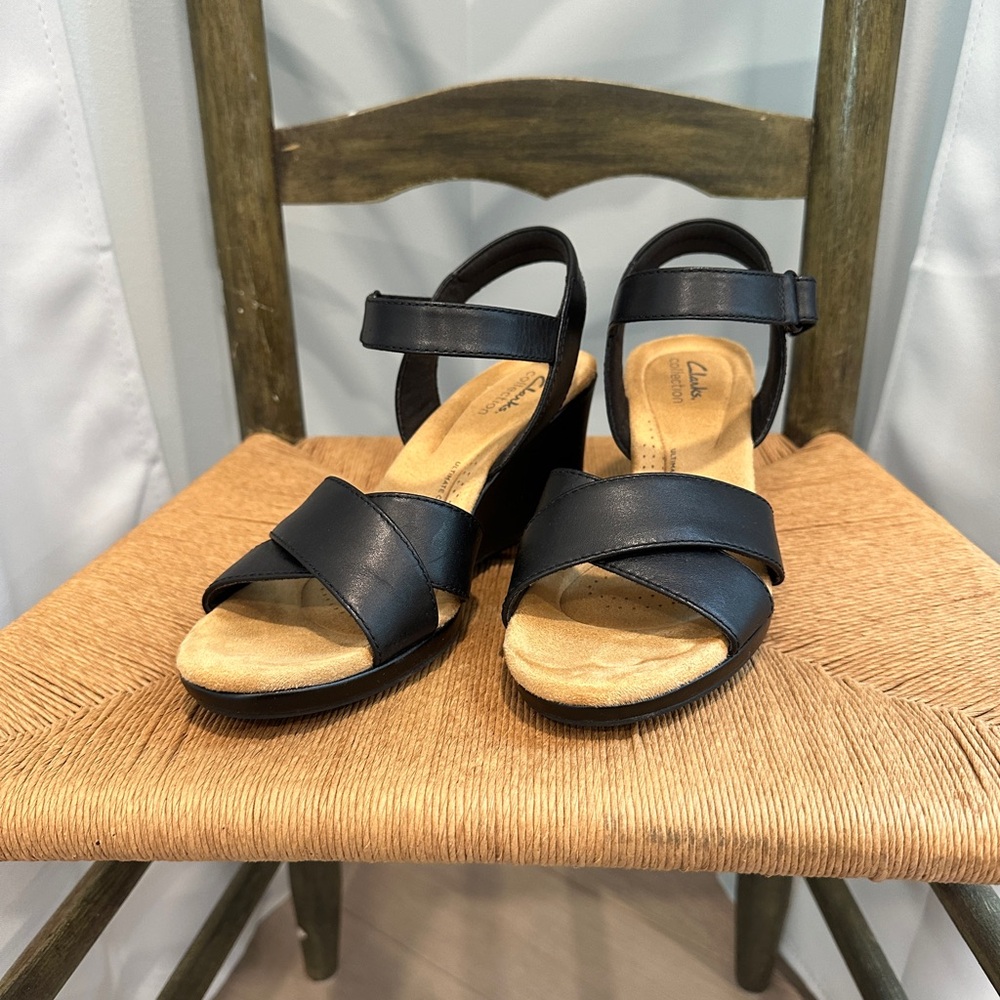 Clark’s black leather wedges